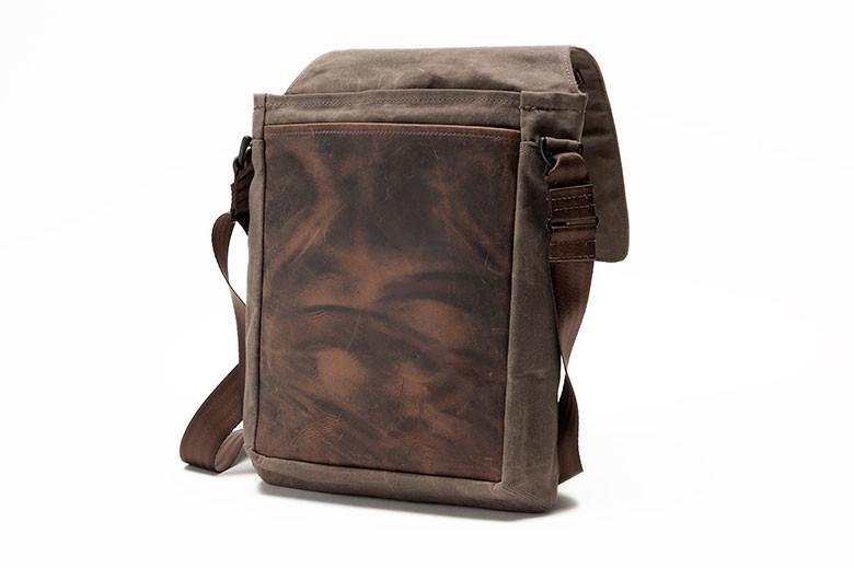 Constructed of full-grain premium leather and light waxed canvas